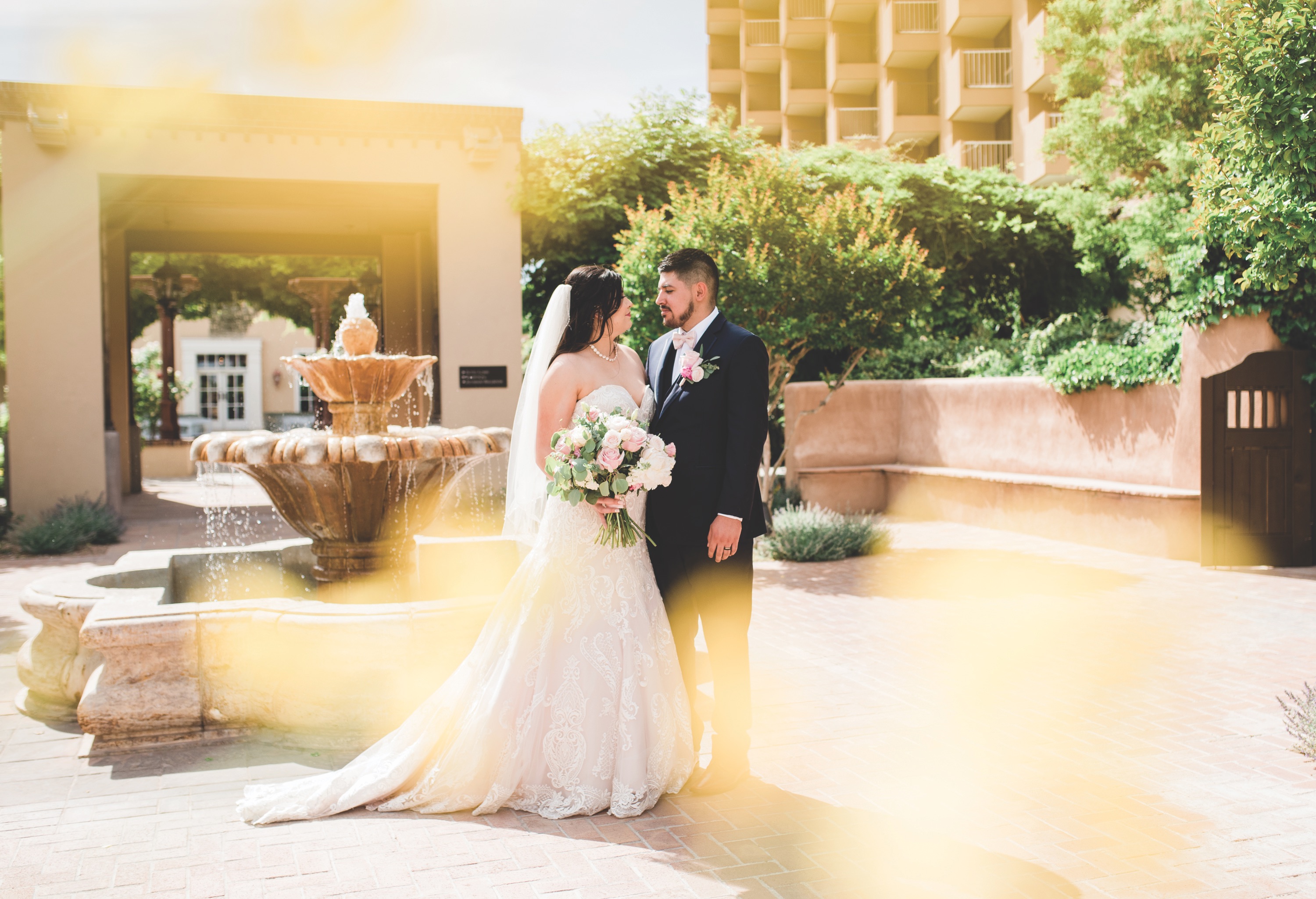 bride smiling at groom, bride, new mexico bride, hotel albuquerque at old town, abq flowers, new mexico weddings, perfect wedding guide